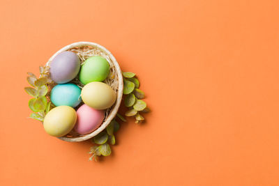 Directly above shot of christmas decorations on pink background