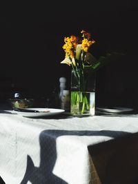 Flower vase on table at home