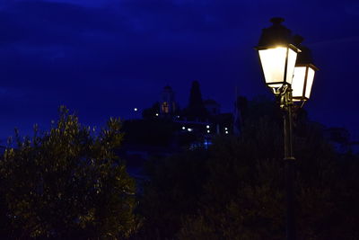 High section of lamp post at night