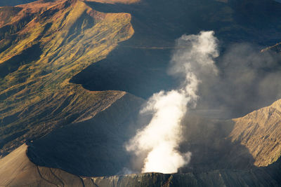 Mount bromo with smoke, mount batok at front,  bromo tengger semeru