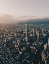 Aerial view of cityscape against sky