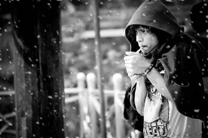 focus on foreground, lifestyles, leisure activity, casual clothing, standing, incidental people, headshot, close-up, street, holding, selective focus, men, person, day, outdoors, front view, childhood, waist up