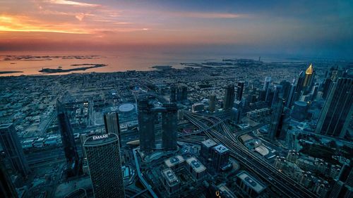 High angle view of city buildings during sunset