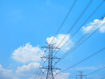 Low angle view of electricity pylon against sky