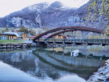 Bridge over river during winter