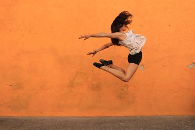 Young woman jumping