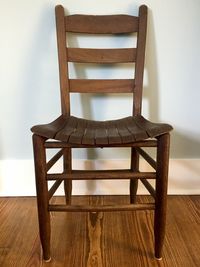 Close-up of empty chairs on table at home