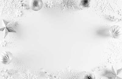 Close-up of bubbles over water against white background
