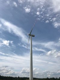 Low angle view of windmill against sky