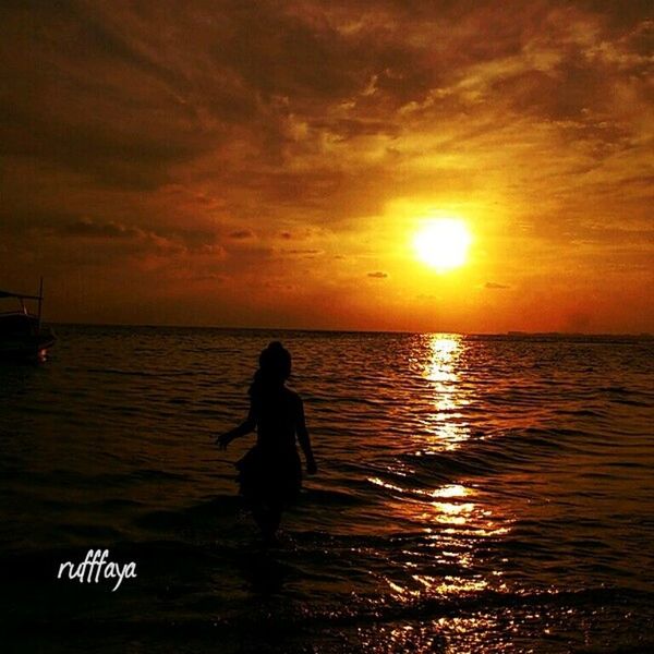 sunset, water, sea, horizon over water, sky, lifestyles, leisure activity, scenics, orange color, cloud - sky, beauty in nature, tranquil scene, men, tranquility, standing, sun, silhouette, nature