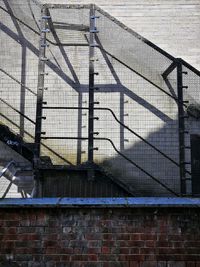 Metal fence by building