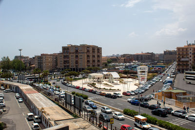 High angle view of city street and buildings against sky