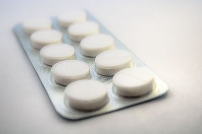 Close-up of pills on white background