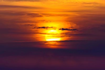 Scenic view of sea against orange sky