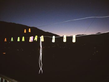 Illuminated lamp post at night