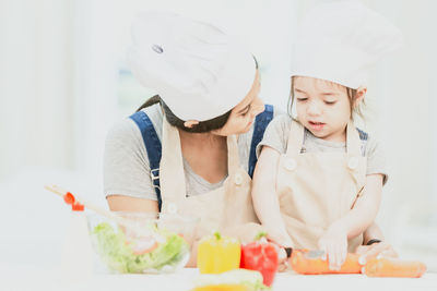 Rear view of people looking food