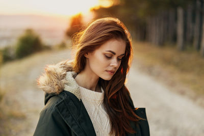 Portrait of young woman outdoors