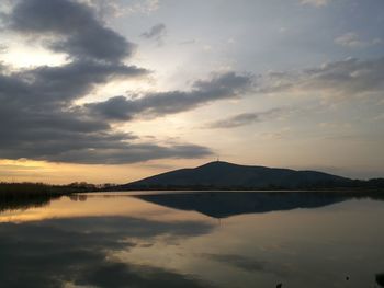 Scenic view of lake against sky during sunset