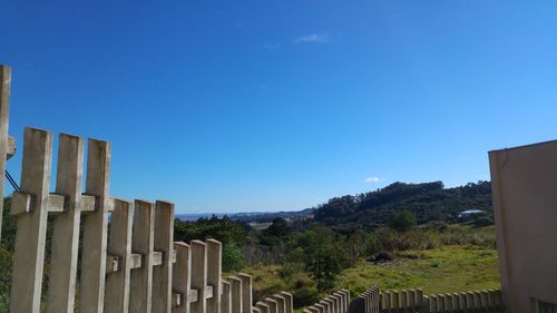 Scenic view of mountains against clear blue sky