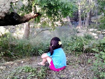 Woman standing in forest