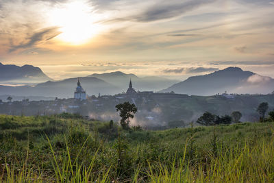 Scenic view of landscape against cloudy sky