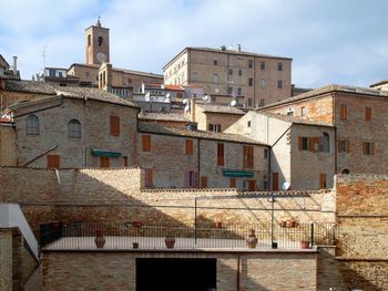 Low angle view of houses in town against sky