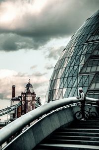 View of buildings against cloudy sky