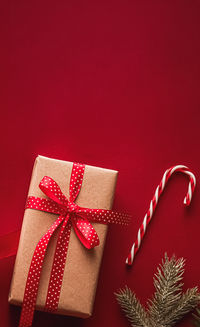 Close-up of gift box on red background