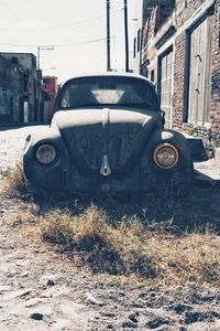 Abandoned car on field