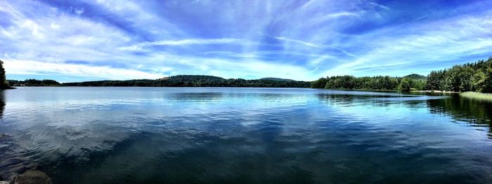 Scenic view of lake against blue sky