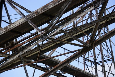 Low angle view of old bridge against sky