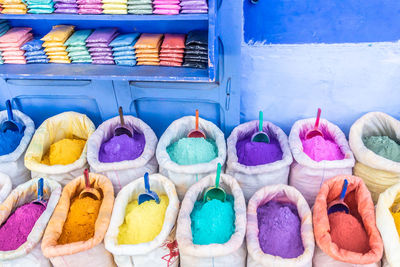 Colorful spices and dyes in the street of the blue city, chefchaouen, morocco.