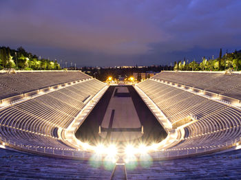 High angle view of illuminated bridge against sky at night