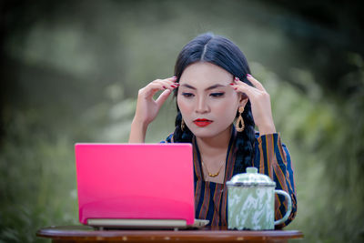 Young woman using mobile phone