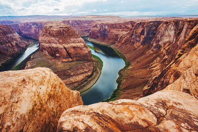 High angle view of rock formations against sky