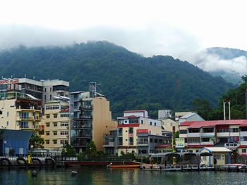 Town by sun moon lake against mountains