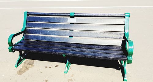 High angle view of empty bench in park