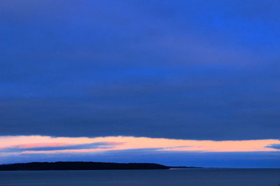 Scenic view of sea against sky at sunset