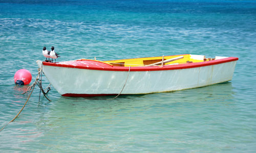 Boat moored in sea