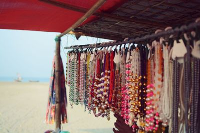 Close-up of clothes hanging in market