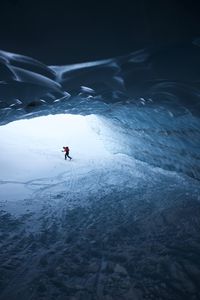 Person skiing on snowcapped mountain