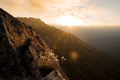 Scenic view of mountains against sky during sunset