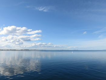 Scenic view of sea against blue sky