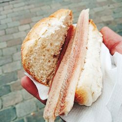 Close-up of hand holding burger