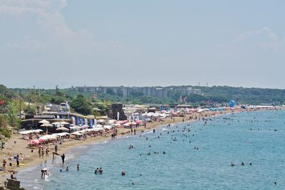 High angle view of people on beach against sky