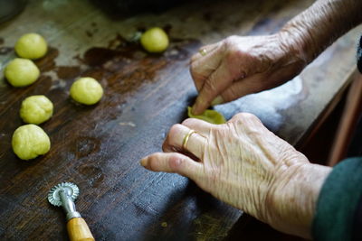 Close-up of hands preparing food