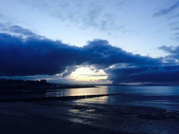 Scenic view of sea against cloudy sky