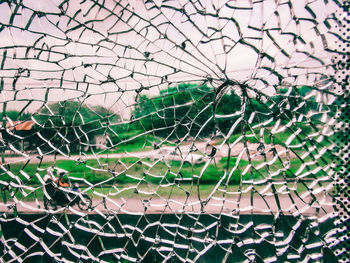 Full frame shot of broken glass window