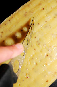 Close-up of hand holding ice cream