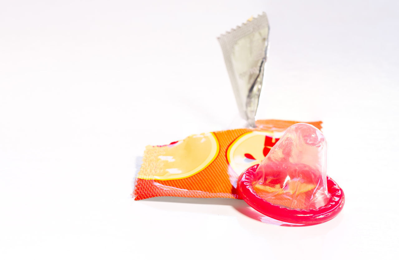 CLOSE-UP OF ICE CREAM OVER WHITE SURFACE